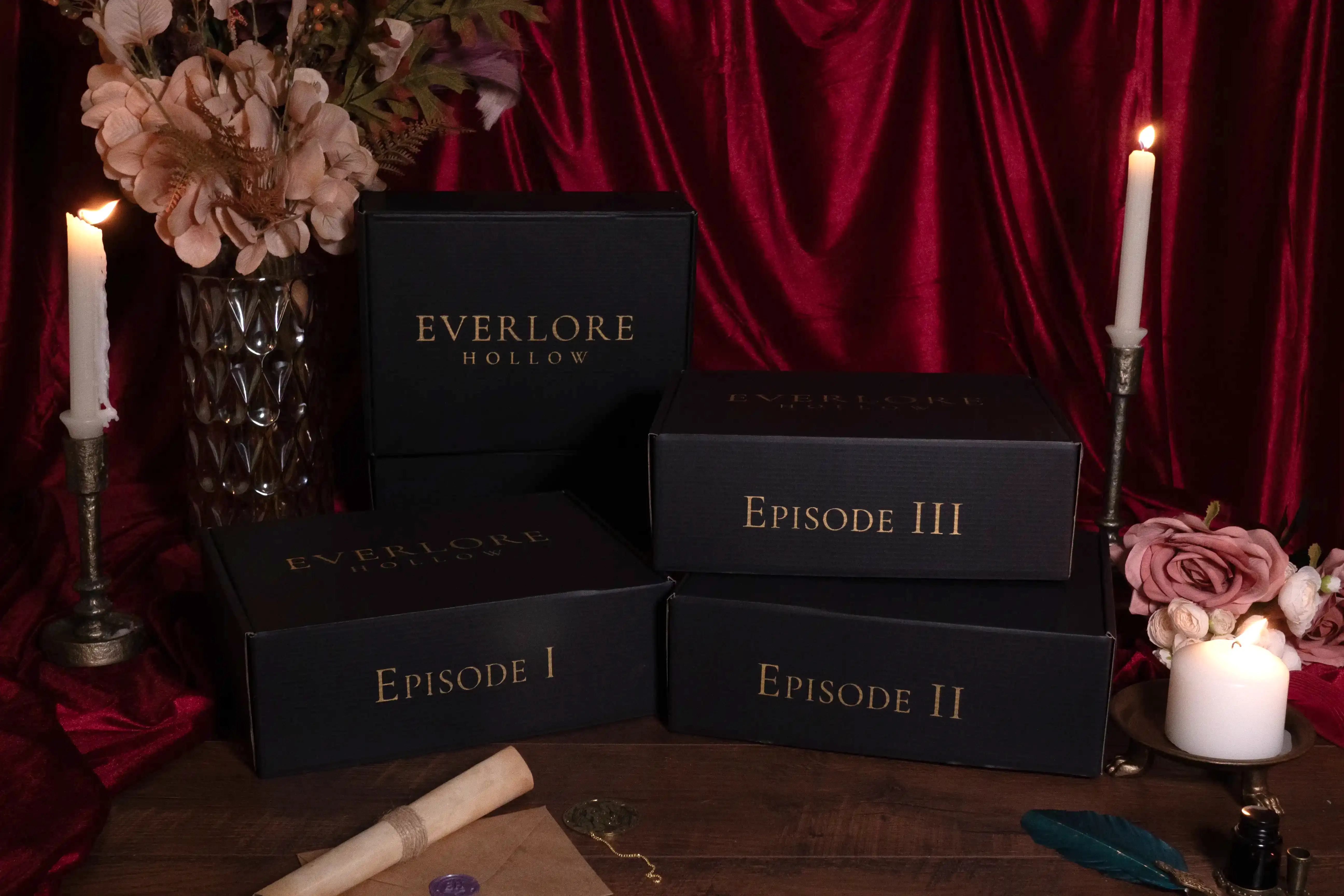 Four printed Everlore Hollow episodes arranged between lit candles