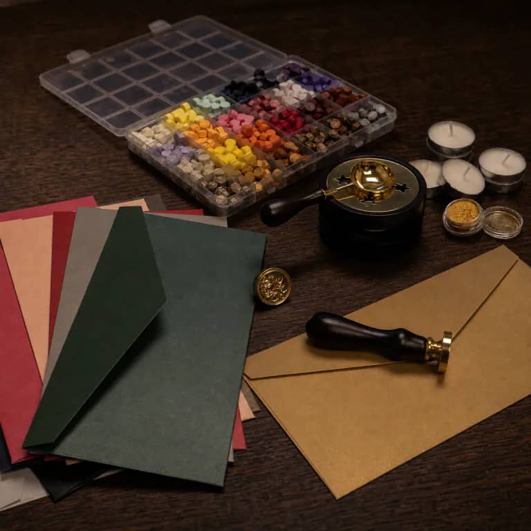 Custom wax seal kit with brass stamp, wax sticks, and melting spoon